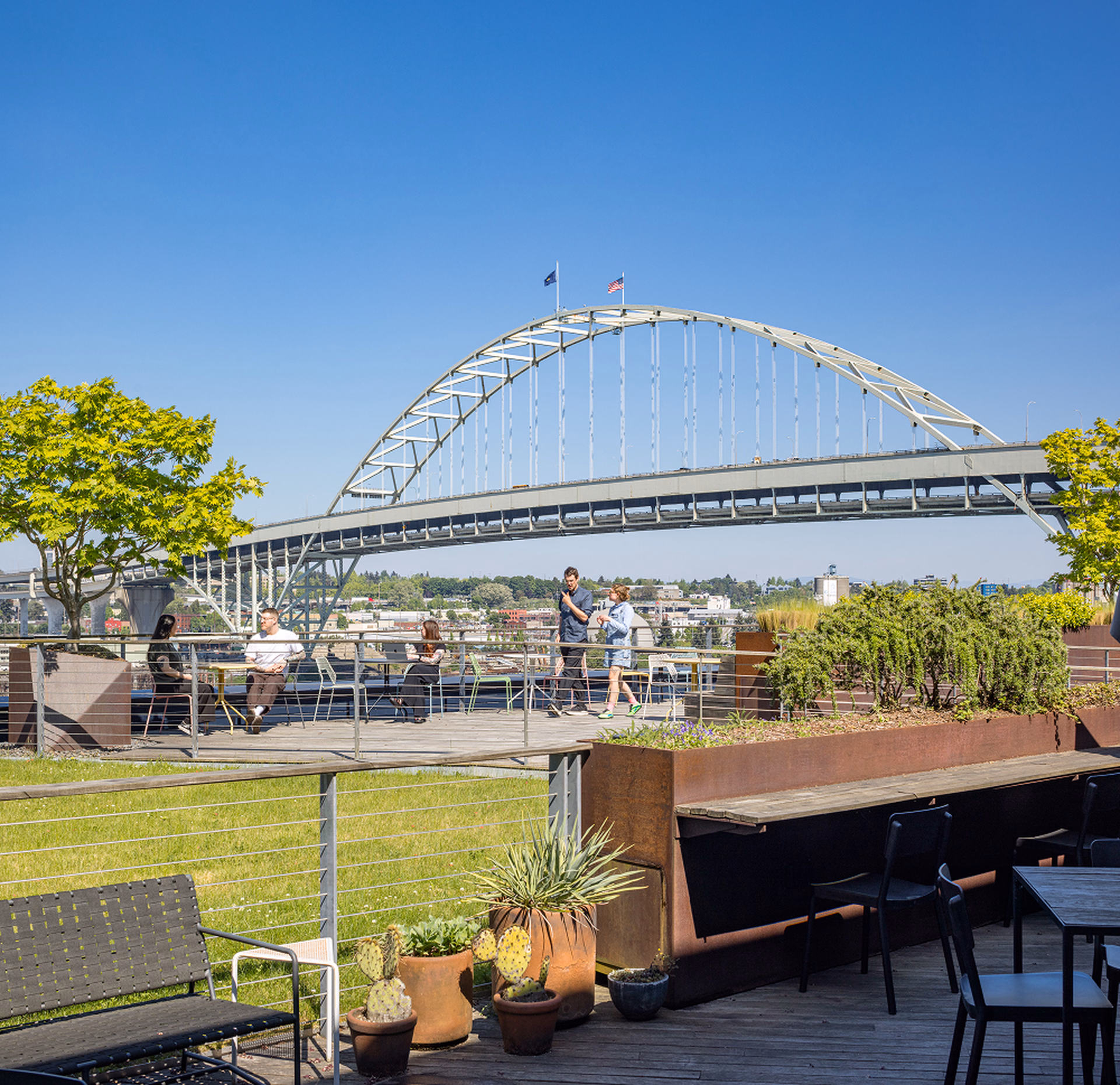 Outdoor terrace workspace with people and city view